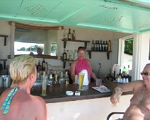 Antigua 064  Rachel got bored waiting to be served so she took over the bar!