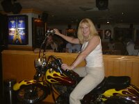 hardrockbeijingbike  Biker girl gets some admiring glances from the other tables in the Hard Rock, Beijing.